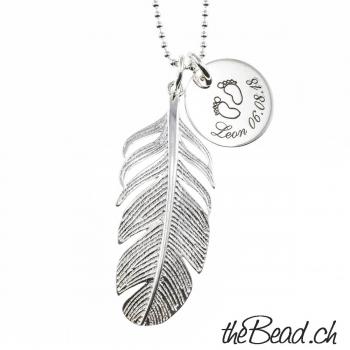 Silver necklace with feather and engraving pendant