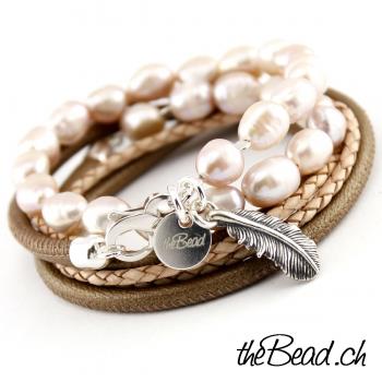 pearl bracelet with feather pendant