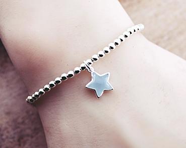 silver bracelet with aquamarine star pendant