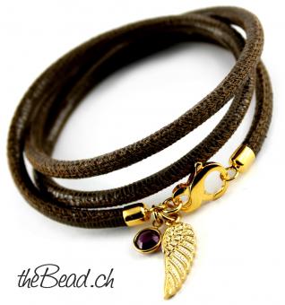 leather bracelet with golden wing pendant