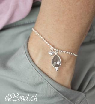 silver bracelet with moonstone and heart pendant