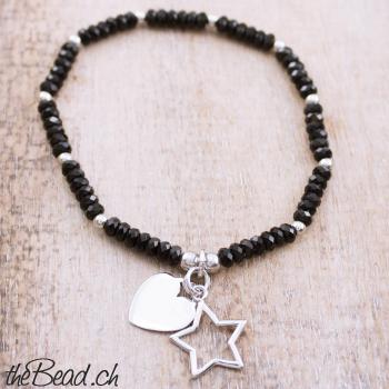 onyx bracelet with heart and star pendants