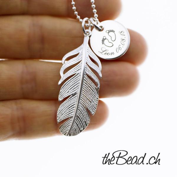 necklace made of silver with feather and engraving pendant